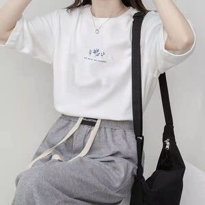 Short - sleeved Korean round neck T-shirt for women in summer with loose plant print casual solid color fire student half - sleeved top - Negative Apparel