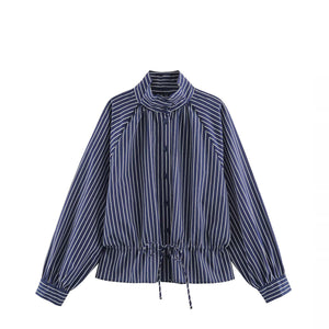 A navy blue and white vertically striped long-sleeve blouse with a mock neck, drawstring waist, and front button closure, shown on a plain white background