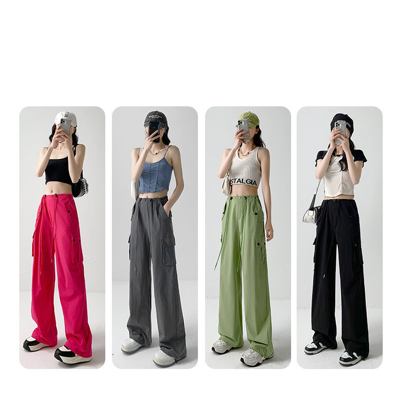 Four women modeling wide-leg cargo pants in different colors: bright pink, charcoal gray, sage green, and black. The image features Chinese text at the top indicating color options.