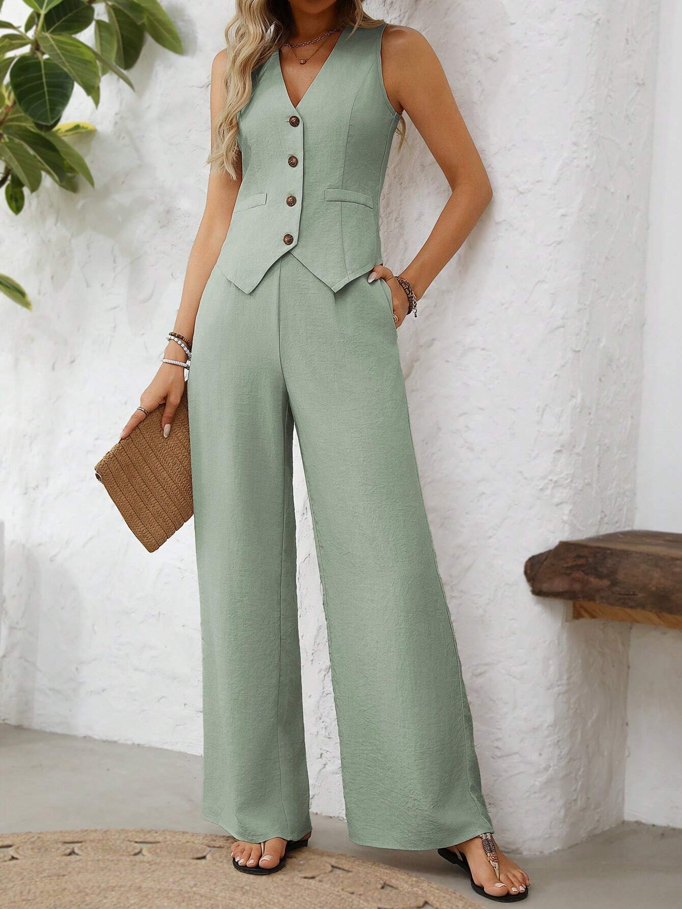 Clasi V - Neck Sleeveless Vest Made Of Chiffon Fabric, Decorated With Single False Pocket And Triangular Hemline, With Button Closure. The Outfit Includes A Pair Of High - Waisted, Straight - Leg Chiffon Pants With Pleated Belt And Side Pockets - Negative Apparel